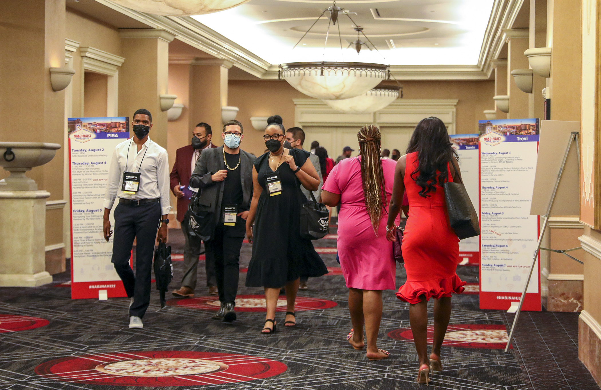 Attendees walk through the halls on their way to sessions on the first day of the NABJ/NAHJ 2022 Convention and Job Fair in Las Vegas, Nev., on Wednesday, August 03, 2022.