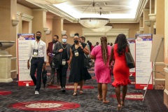 Attendees walk through the halls on their way to sessions on the first day of the NABJ/NAHJ 2022 Convention and Job Fair in Las Vegas, Nev., on Wednesday, August 03, 2022.