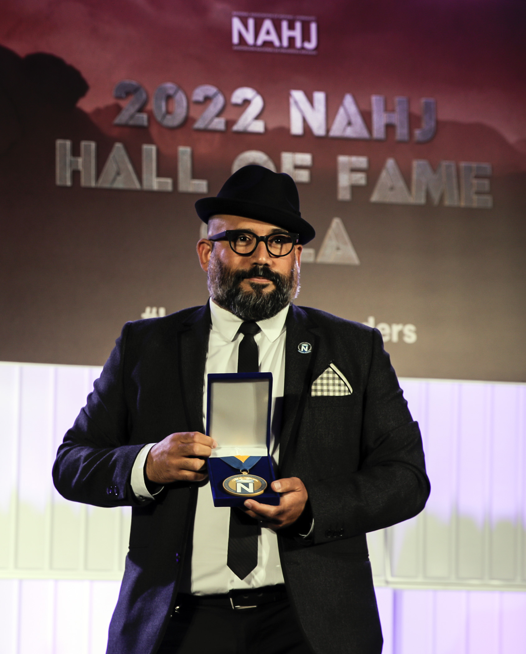 Robert Hernandez with his Hall of Fame induction medal at the 2022 NAHJ Hall of Fame Gala in Las Vegas, Nev., on Saturday, August 5, 2022.