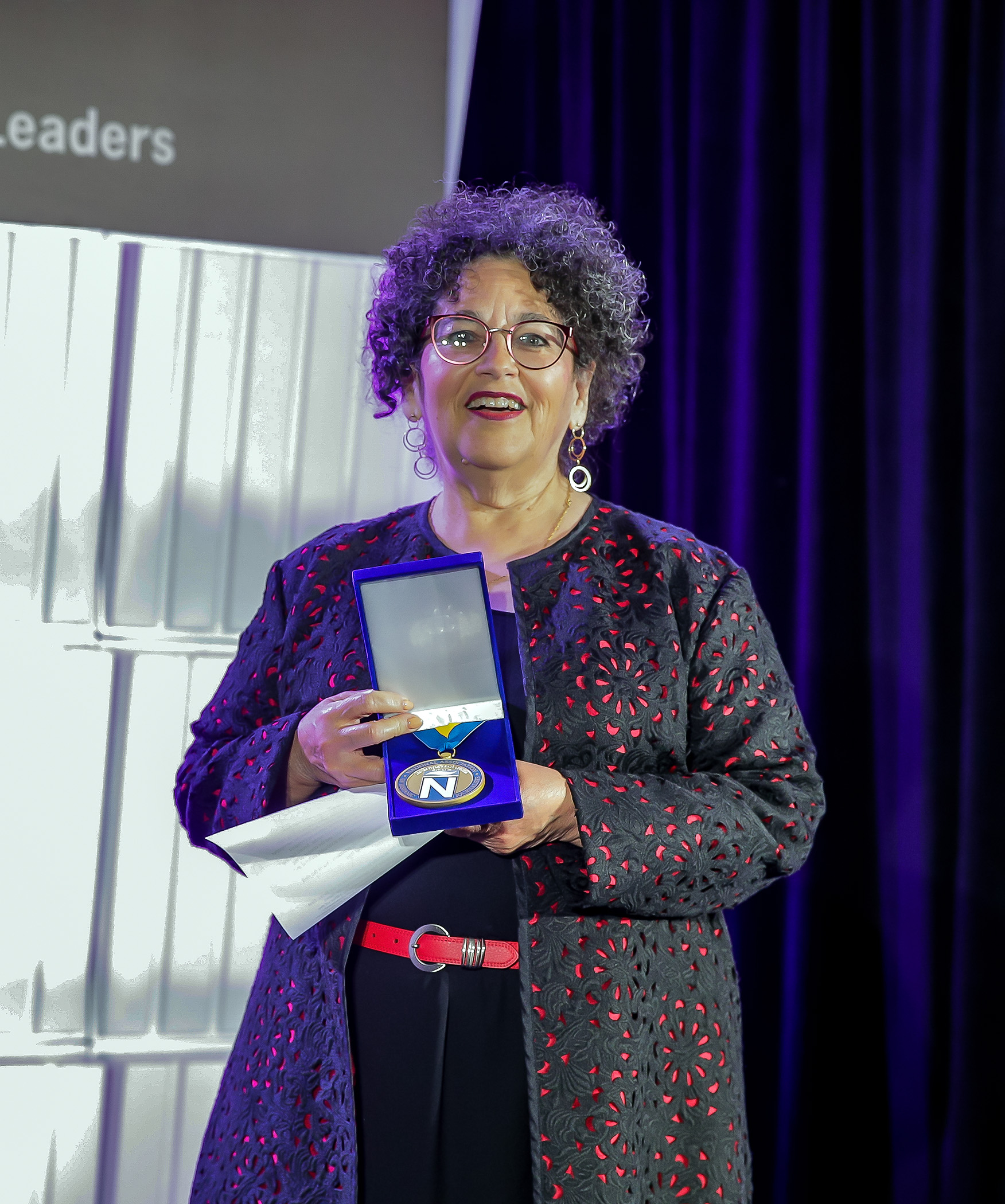 Diana R. Fuentes with her Hall of Fame induction medal at the 2022 NAHJ Hall of Fame Gala in Las Vegas, Nev., on Saturday, August 5, 2022.