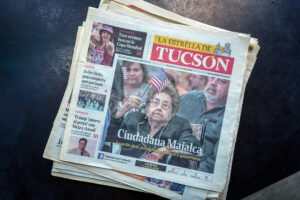 La Estrella newspaper cover shows an 86-year-old-woman who received her citizenship.